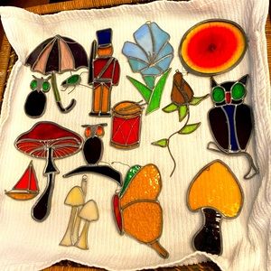 Handmade hanging stained glass. Various pieces shown .Made in Massachusetts .